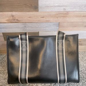 Like new Haute Shore large tote. Neoprene. Black with gray striped straps.